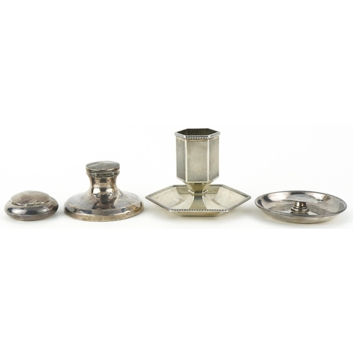 191 - Silver objects including an engine turned match stand and a capstan inkwell, the largest 7.5cm high,... 