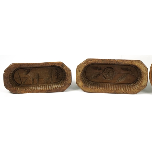 247 - Six Antique French treen butter moulds including examples carved with flowers, the largest 20.5cm in... 