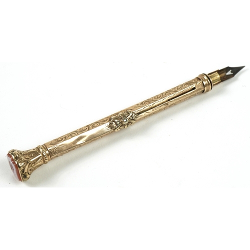 180 - Victorian unmarked gold combination propelling pencil and dip pen with hardstone seal top end, 21.8g