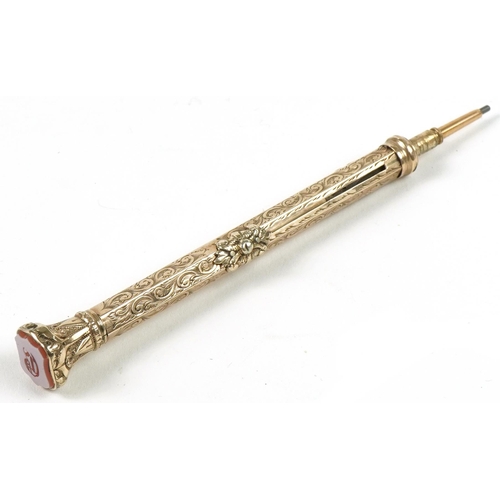 180 - Victorian unmarked gold combination propelling pencil and dip pen with hardstone seal top end, 21.8g