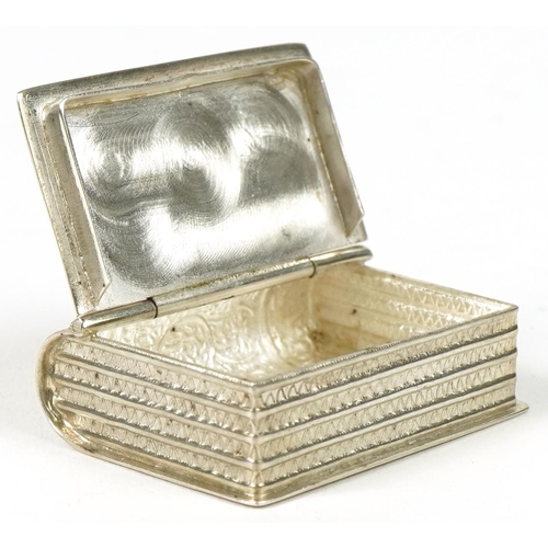 291 - Novelty silver vesta in the form of a book, 3.5cm in length, 14.6g