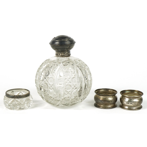 134 - Edwardian and later silver objects including a large globular cut glass scent bottle with silver lid... 