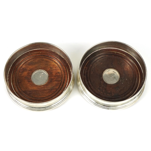 1107A - W I Broadway & Co, pair of Elizabeth II circular silver and oak wine coasters, Birmingham 1995, 12.5... 