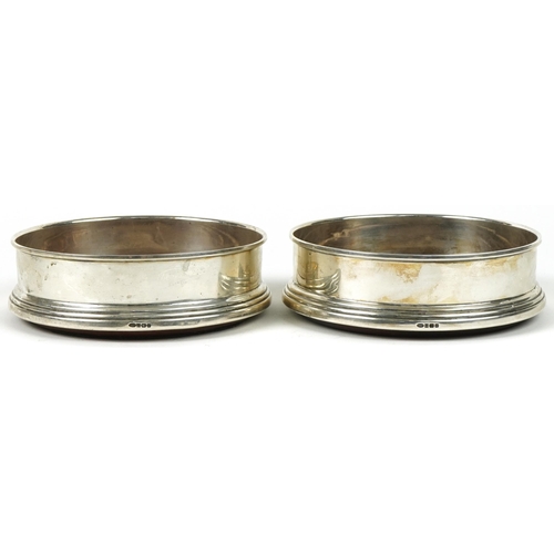 1107A - W I Broadway & Co, pair of Elizabeth II circular silver and oak wine coasters, Birmingham 1995, 12.5... 