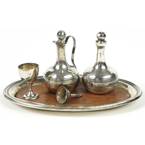 226 - Miniature silver objects including oval tray, claret jug, decanter, goblet and funnel, various hallm... 