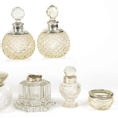 132 - Victorian and later silver mounted cut glass scent bottles, inkwells and jars, the largest 11.5cm hi... 