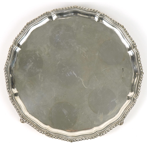 62 - Joseph Rodgers & Sons Ltd, circular silver salver raised on four ball and claw feet, Sheffield 1936,... 