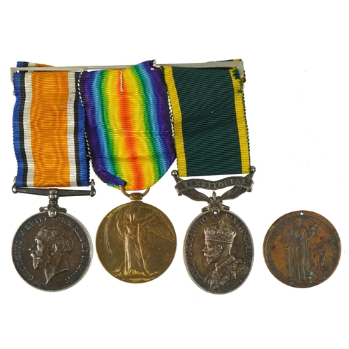 414 - British military World War I three medal group and a peace medallion, the medals comprising World Wa... 