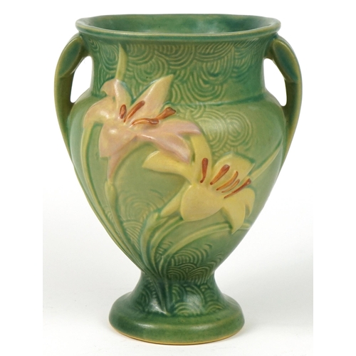 286 - Roseville, American pottery twin handled vase decorated in relief with flowers, 21.5cm high