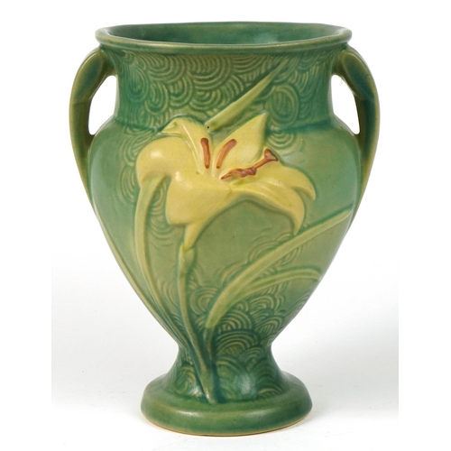 286 - Roseville, American pottery twin handled vase decorated in relief with flowers, 21.5cm high