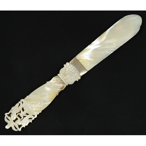 187 - 19th century mother of pearl page turner with floral carved handle and white metal mount, 26.5cm in ... 