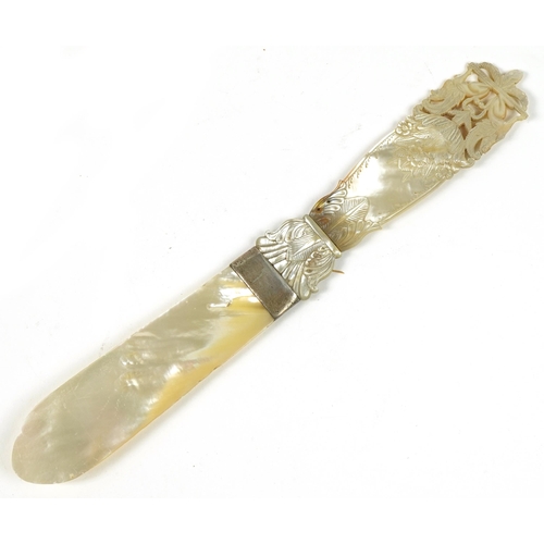 187 - 19th century mother of pearl page turner with floral carved handle and white metal mount, 26.5cm in ... 