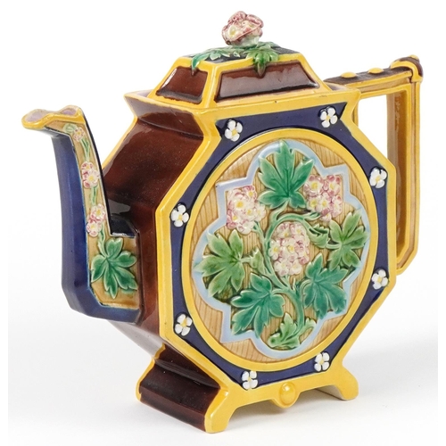 128 - Brown Westhead Moore, Victorian aesthetic Majolica teapot decorated in relief with flowers, 22.5cm i... 