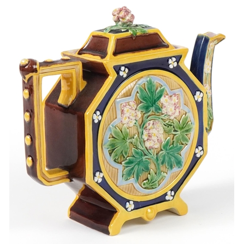 128 - Brown Westhead Moore, Victorian aesthetic Majolica teapot decorated in relief with flowers, 22.5cm i... 