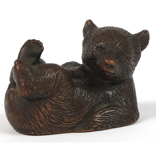 47 - German patinated bronze bear impressed 189 Geschutzt Depose to the base, 9.5cm in length