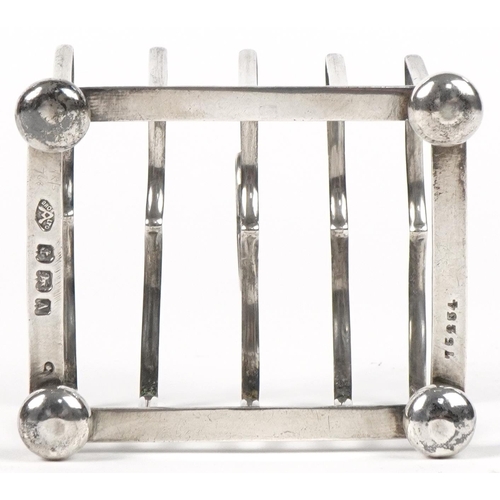 192 - Adie Brothers Ltd, George V silver four slice toast rack, Birmingham 1925, 8cm in length, 78.5g