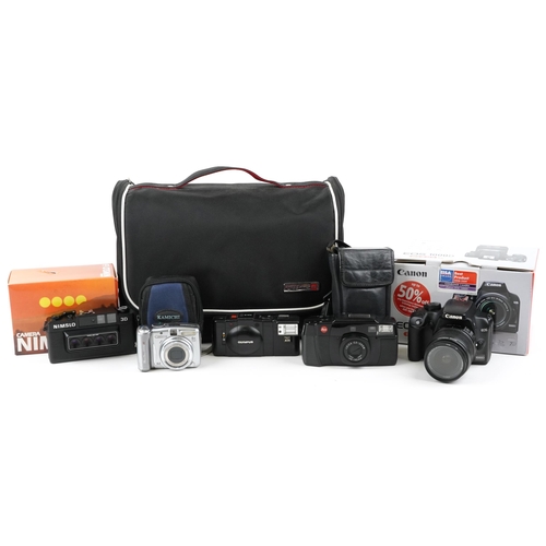 1327 - Cameras comprising Canon 1000D, Leica C2 Zoom, Olympus XA2, Canon A720 and Nimslo 3D