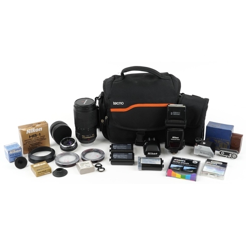 1329 - Camera lenses and accessories including Nikon 70-300 VR lens, metred head for Nikon F and DP-30 head... 