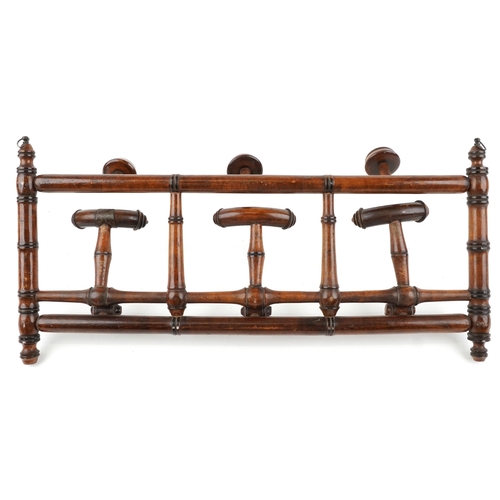 1228 - Aesthetic hardwood adjustable coat rack, 62cm wide