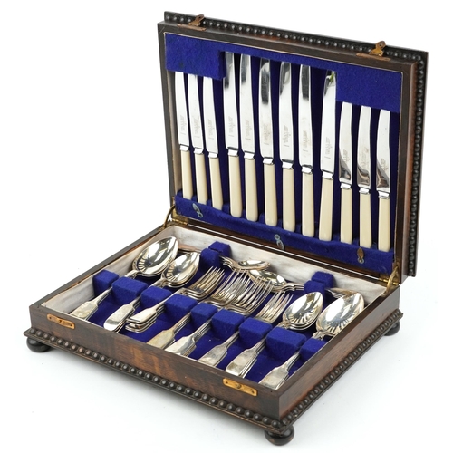 1207 - Victorian and later silver cutlery, predominantly by James Dixon & Sons Ltd, housed in an oak cantee... 