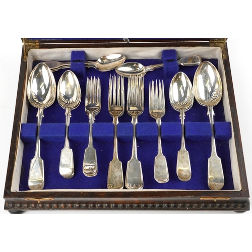 1207 - Victorian and later silver cutlery, predominantly by James Dixon & Sons Ltd, housed in an oak cantee... 