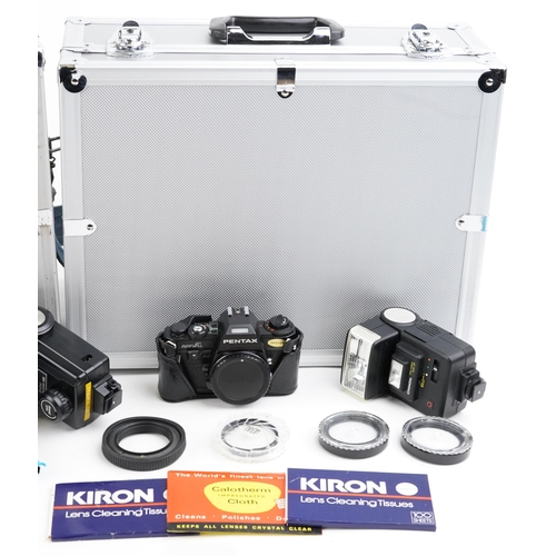 1334 - Cameras and accessories in fitted cases including Canon A1W/50mm lens and Canon T70