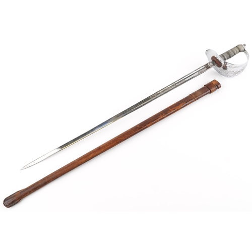 483 - British military George V dress sword with leather scabbard and engraved steel blade, 102.5cm in len... 