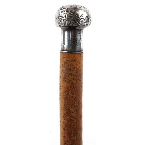 332 - Malacca walking stick with Chinese silver pommel engraved with dragons, 85cm in length