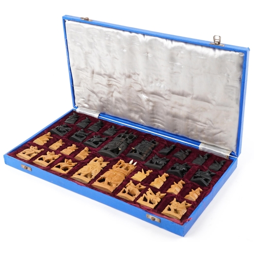 1361 - Indian carved coromandel and boxwood chess set housed in a fitted case, the largest pieces each 12cm... 