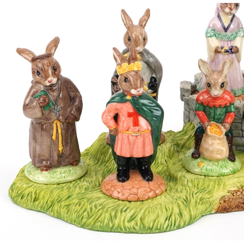 373 - Set of eight Royal Doulton Bunnykins figures from the Robin Hood Collection with display stand compr... 