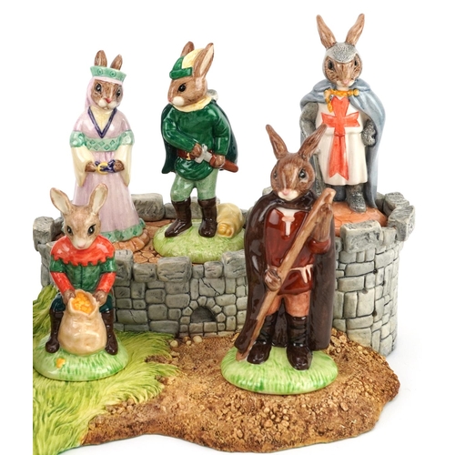 373 - Set of eight Royal Doulton Bunnykins figures from the Robin Hood Collection with display stand compr... 