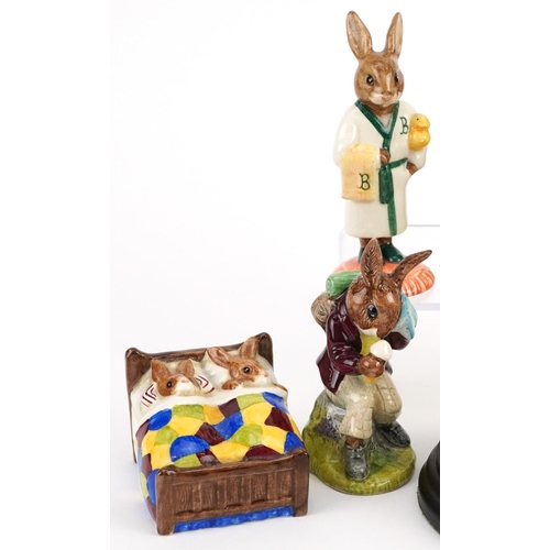 360 - Nine Royal Doulton Bunnykins figures with display stand, one with certificate, comprising Billy 