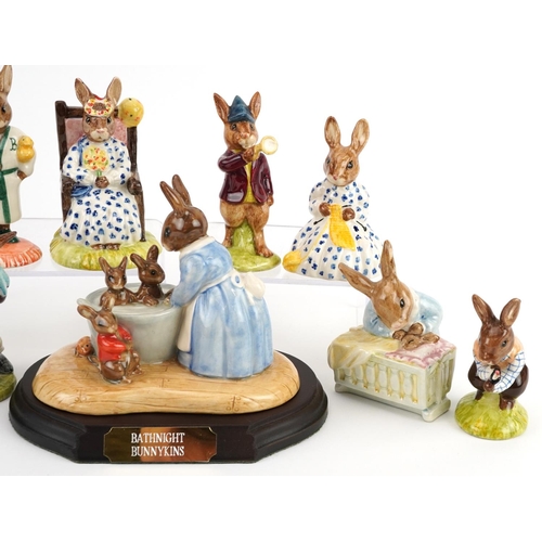 360 - Nine Royal Doulton Bunnykins figures with display stand, one with certificate, comprising Billy 