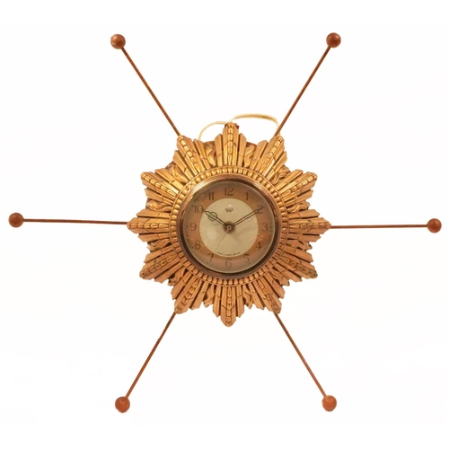 1970s Smith Sectric sunburst wall clock with circular dial having Arabic numerals, overall 43cm in diameter