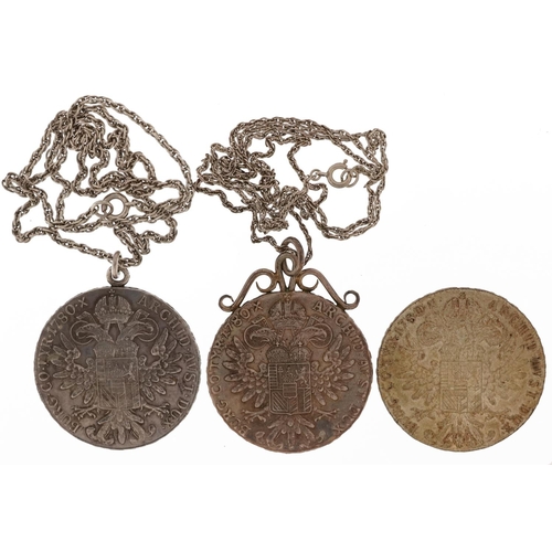 1412 - Three Maria Theresa thaler coins, two with pendant mounts on necklaces