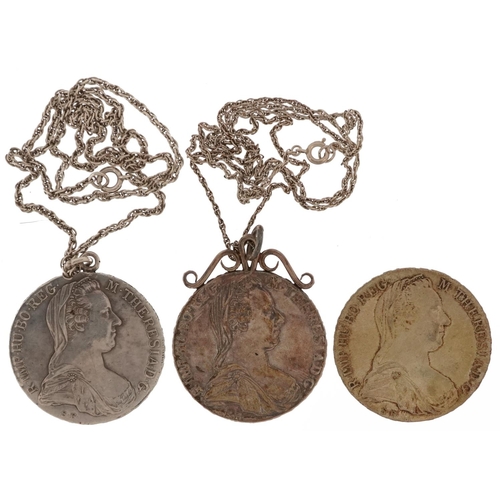 1412 - Three Maria Theresa thaler coins, two with pendant mounts on necklaces