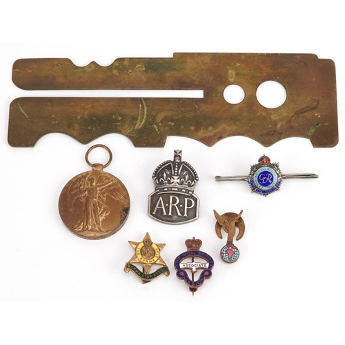 452 - Militaria including brass button cleaner, silver and enamel Royal Army Service Corps sweetheart broo... 