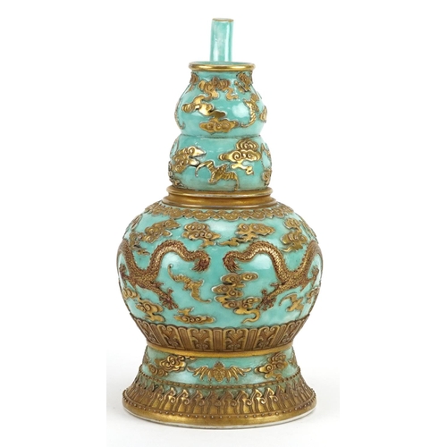 92 - Chinese porcelain turquoise ground wine vessel gilded with dragons and bats amongst clouds, six figu... 