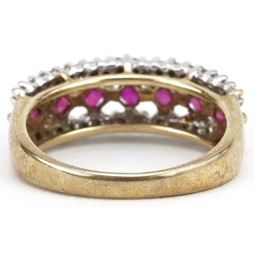 2091 - 9ct gold ruby and diamond three row half eternity ring, size J/K, 3.0g