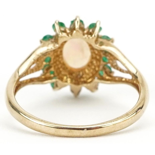 2182 - 9ct gold cabochon opal and emerald cluster ring with pierced shoulders, size L, 2.0g