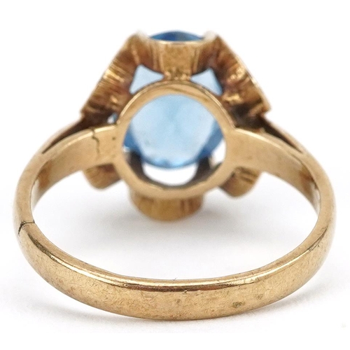 2148 - 9ct gold blue topaz solitaire ring with pierced flower head setting, the topaz approximately 10.0mm ... 