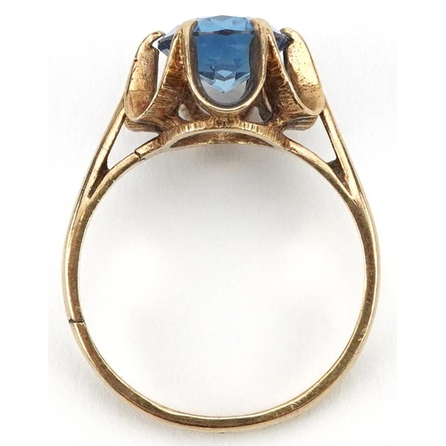 2148 - 9ct gold blue topaz solitaire ring with pierced flower head setting, the topaz approximately 10.0mm ... 