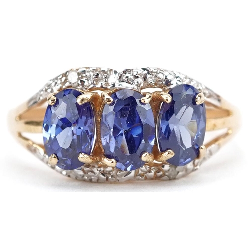 2757 - 9ct gold tanzanite and diamond ring with split shoulders, size M, 1.4g