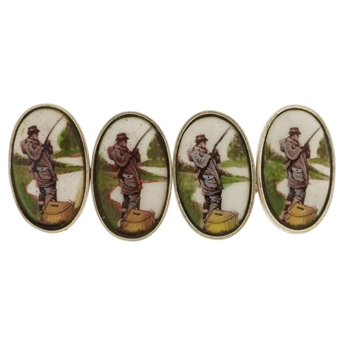 2134 - Pair of silver and enamel fisherman cufflinks, 2.4cm in length, 8.7g