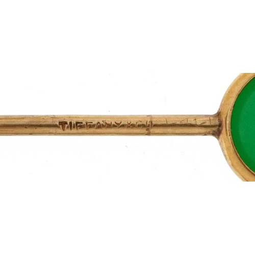 2756 - Tiffany & Co, unmarked gold green stone stickpin with box, tests as 14ct gold, housed in an S Kind &... 