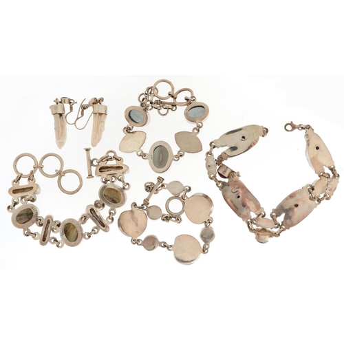 2714 - Silver semi precious stone jewellery comprising four bracelets and a pair of earrings, 102.0g