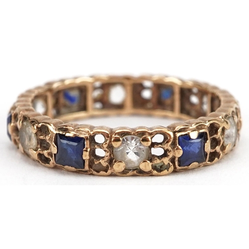 2024 - Unmarked gold sapphire and white spinel eternity ring, tests as 9ct gold, size L/M, 2.2g