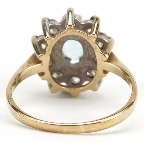 2138 - 9ct gold blue topaz and clear stone cluster ring, size M, 3.1g