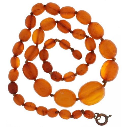 2115 - Butterscotch amber coloured graduated bead necklace, the largest bead approximately 1.9cm wide, over... 