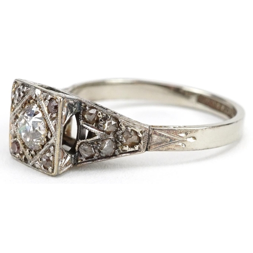 2044 - Art Deco 18ct white gold and platinum diamond ring with pierced shoulders, the central diamond appro... 